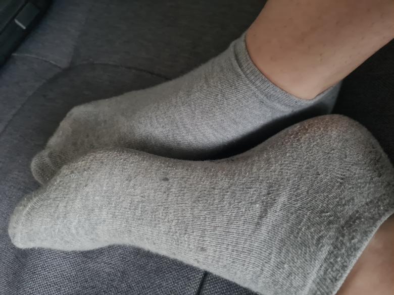 Graue getragene Sockem